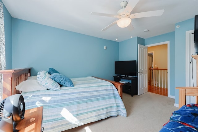 carpeted bedroom featuring ceiling fan