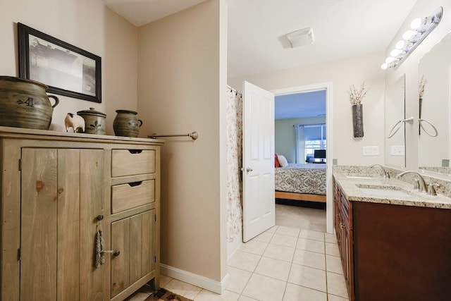 bathroom with tile patterned floors, curtained shower, and vanity