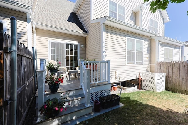 exterior space with a wooden deck and a yard