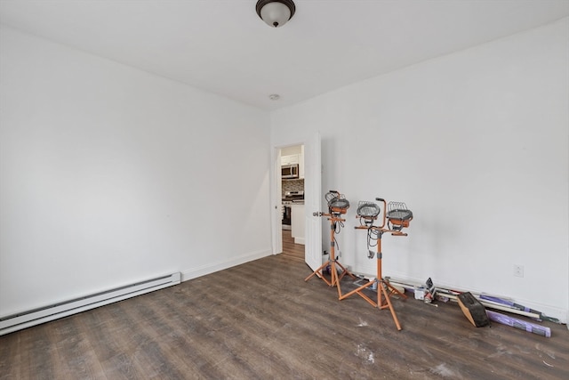 interior space featuring dark wood-type flooring and baseboard heating