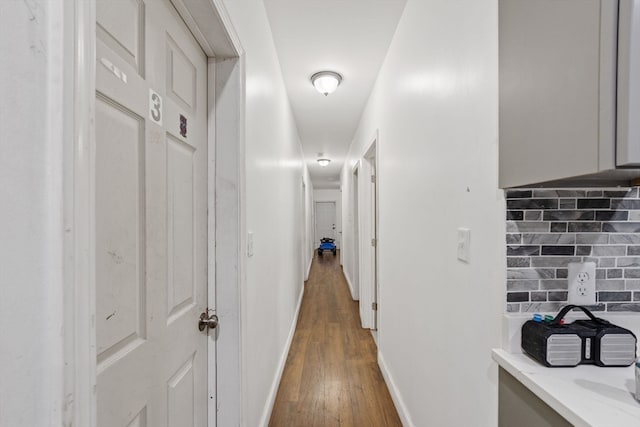 hall with dark hardwood / wood-style flooring