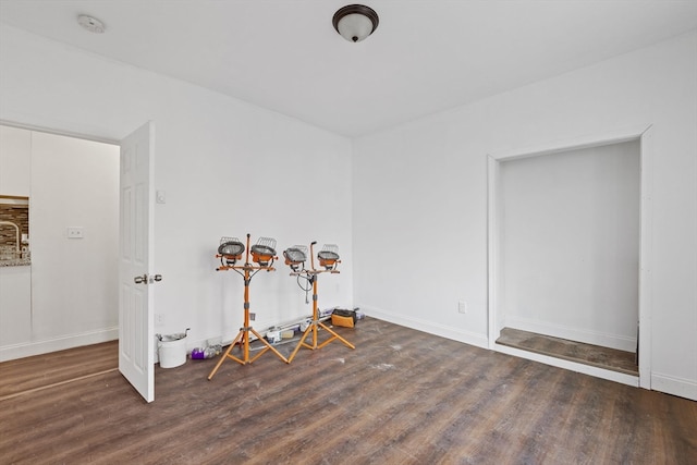 miscellaneous room with dark hardwood / wood-style floors