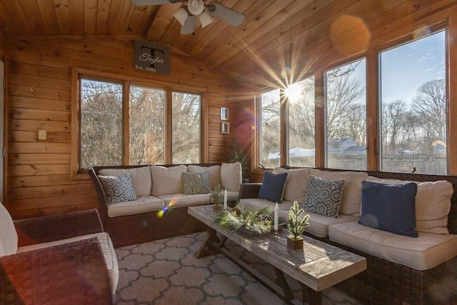 sunroom / solarium with vaulted ceiling, wood ceiling, and a ceiling fan