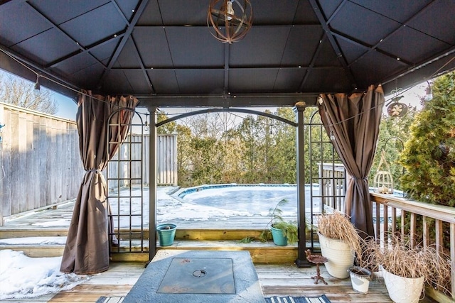 view of patio featuring a deck and a gazebo