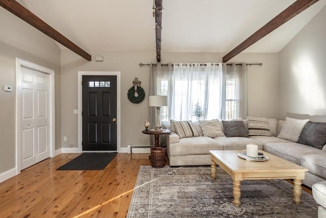 living room with a baseboard radiator, vaulted ceiling with beams, baseboards, and wood finished floors