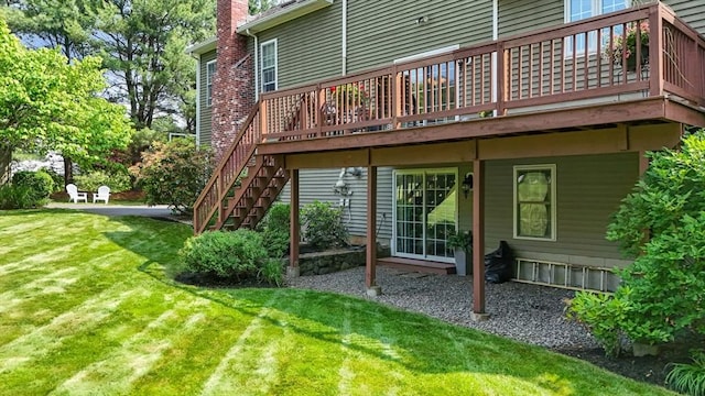 356 Grafton St, Shrewsbury, MA 01545 - back of property with a yard, a deck, and a chimney
