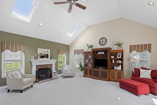 356 Grafton St, Shrewsbury, MA 01545 - carpeted living room featuring a skylight, a fireplace, plenty of natural light, recessed lighting, and high vaulted ceiling