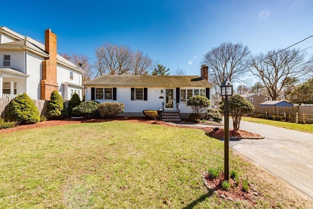 32 Hampden Ave, Brockton, MA 02301 - view of front of house with a chimney and driveway