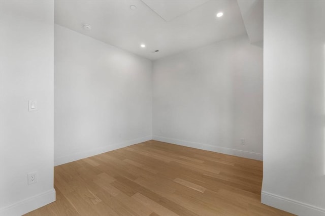 unfurnished room with light hardwood / wood-style floors