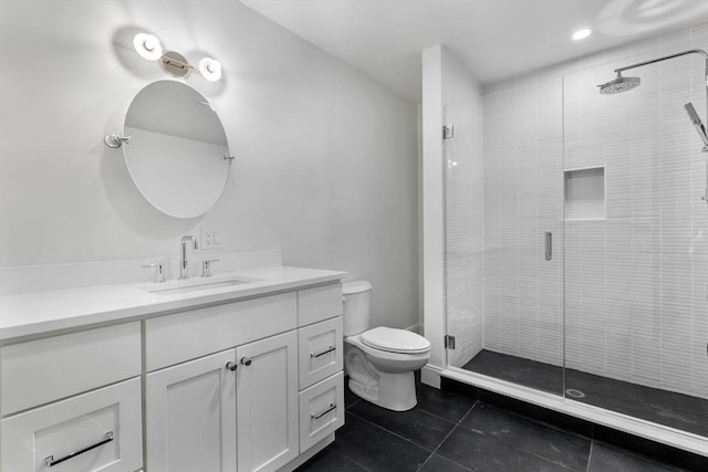 bathroom with tile patterned floors, vanity, toilet, and an enclosed shower