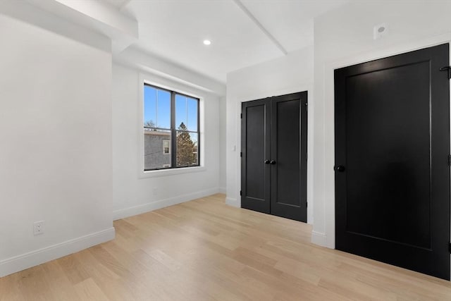 unfurnished bedroom featuring light hardwood / wood-style flooring