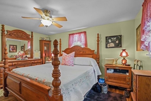 bedroom with ceiling fan and wood-type flooring