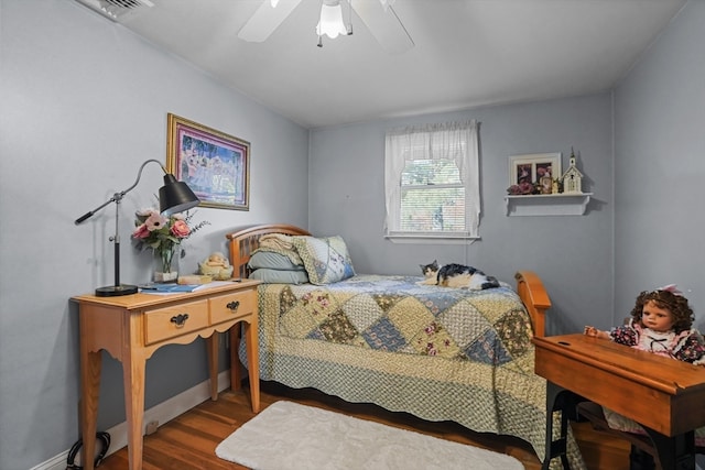 bedroom featuring wood-type flooring and ceiling fan