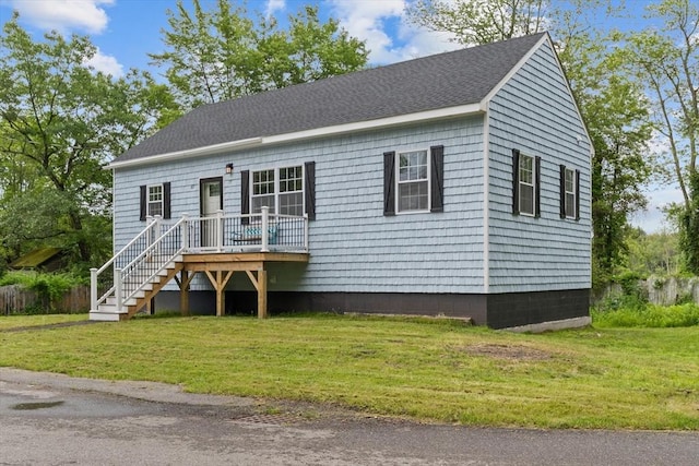 67 Elliott Ave, Dracut, MA 01826 - view of front of home featuring a front yard and roof with shingles