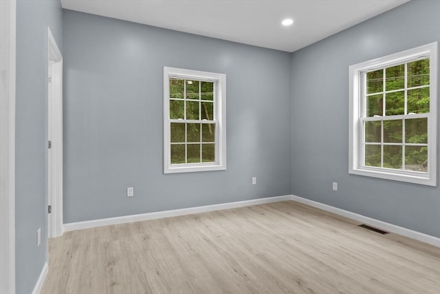 67 Elliott Ave, Dracut, MA 01826 - unfurnished room featuring light wood-style floors, plenty of natural light, and recessed lighting