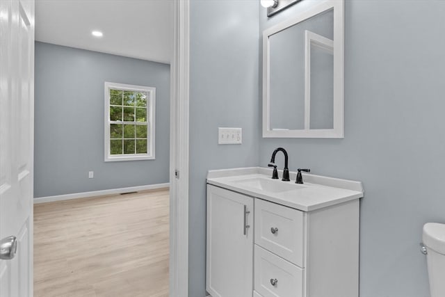 67 Elliott Ave, Dracut, MA 01826 - bathroom featuring vanity, wood finished floors, and recessed lighting