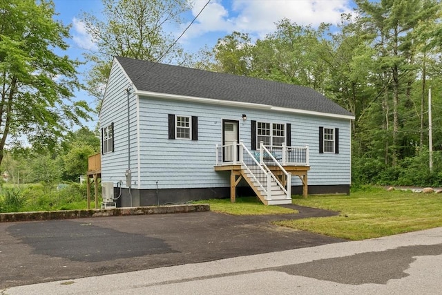 67 Elliott Ave, Dracut, MA 01826 - view of front of property featuring a front yard and roof with shingles