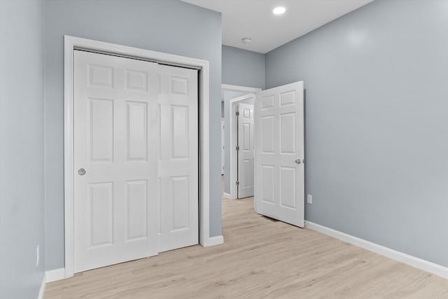 67 Elliott Ave, Dracut, MA 01826 - unfurnished bedroom featuring light wood finished floors, a closet, and recessed lighting