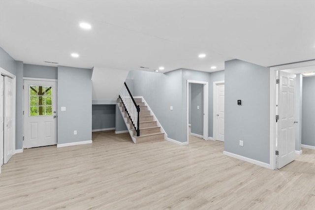 67 Elliott Ave, Dracut, MA 01826 - unfurnished living room featuring stairs, light wood-style flooring, and recessed lighting