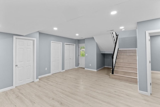 67 Elliott Ave, Dracut, MA 01826 - basement featuring wood finished floors, stairs, and recessed lighting