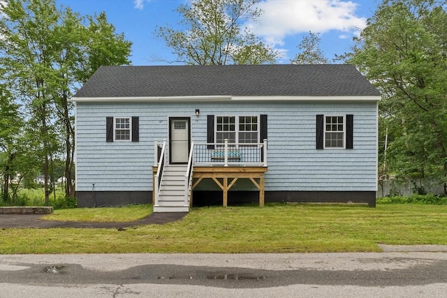 67 Elliott Ave, Dracut, MA 01826 - view of front facade featuring a front lawn and a deck