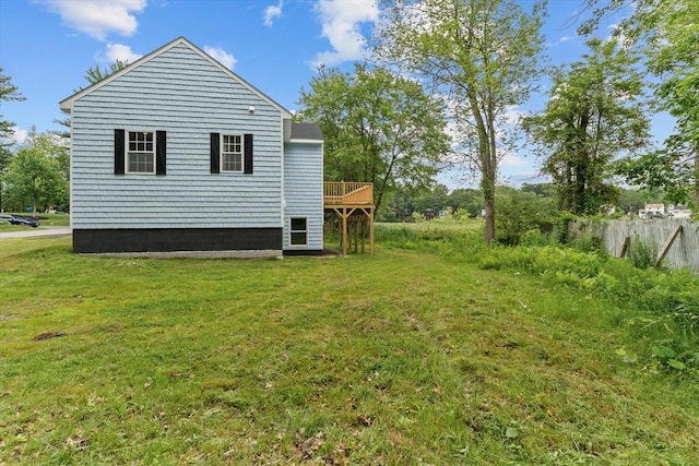 67 Elliott Ave, Dracut, MA 01826 - rear view of house featuring a yard and a deck