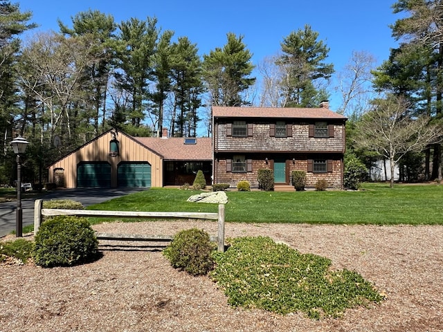 view of front of house with a front lawn and a garage