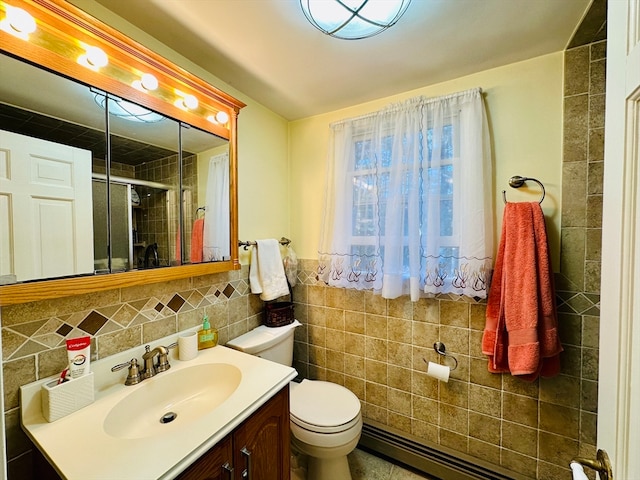 bathroom featuring walk in shower, a baseboard heating unit, toilet, vanity, and tile walls