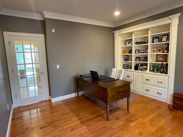 home office with light wood-type flooring and crown molding