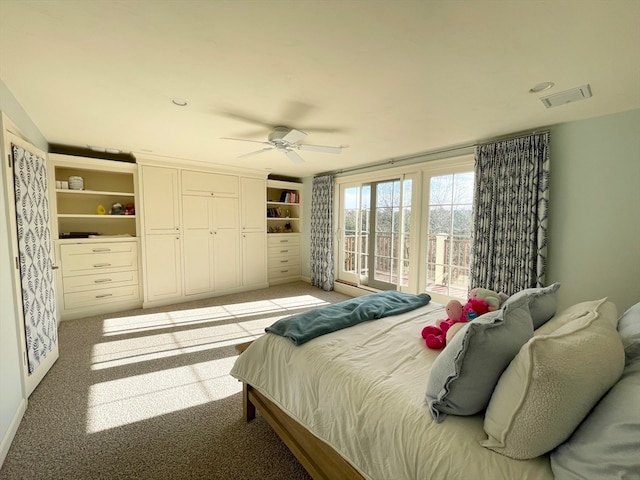 bedroom with ceiling fan and light colored carpet