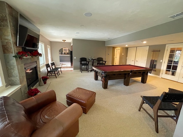 game room featuring light carpet, a healthy amount of sunlight, and billiards