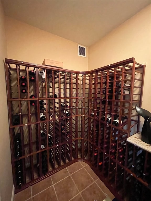 wine area with tile patterned flooring