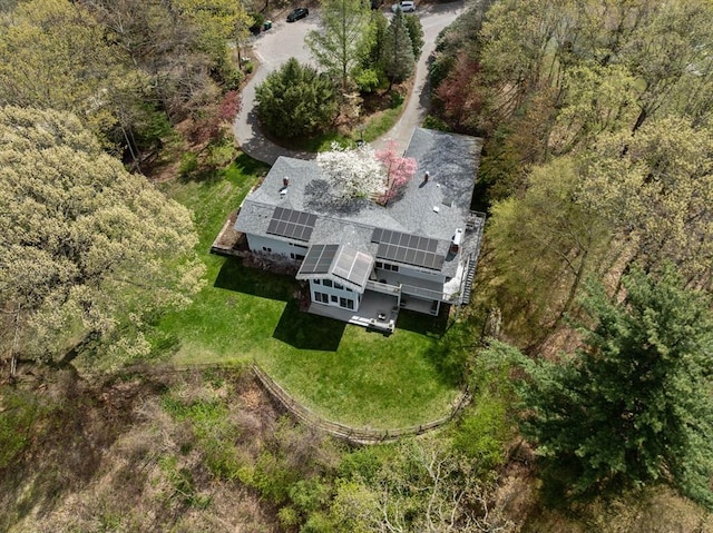 view from above of property with a heavily wooded area