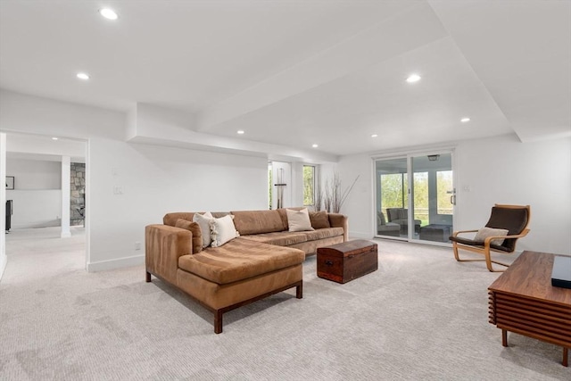living room featuring light colored carpet, recessed lighting, and baseboards