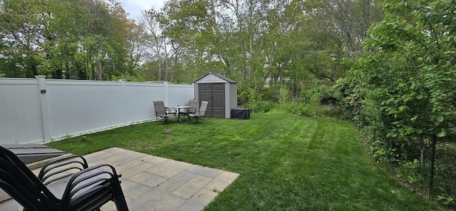 46 Beach Rd Unit B, Yarmouth, MA 02673 - fenced backyard featuring a storage unit and a patio area
