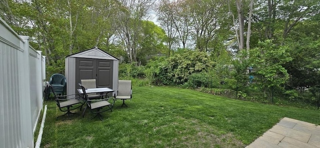 46 Beach Rd Unit B, Yarmouth, MA 02673 - view of green lawn featuring a storage unit and view of scattered trees