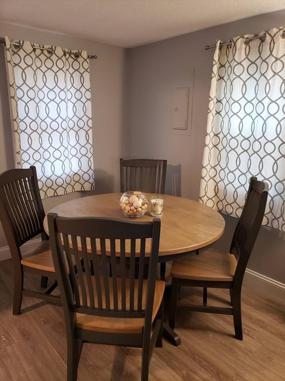 46 Beach Rd Unit B, Yarmouth, MA 02673 - dining area with wood finished floors and a textured ceiling