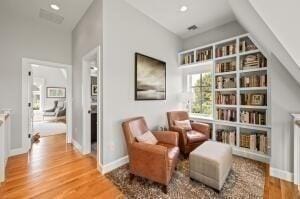 sitting room with hardwood / wood-style flooring