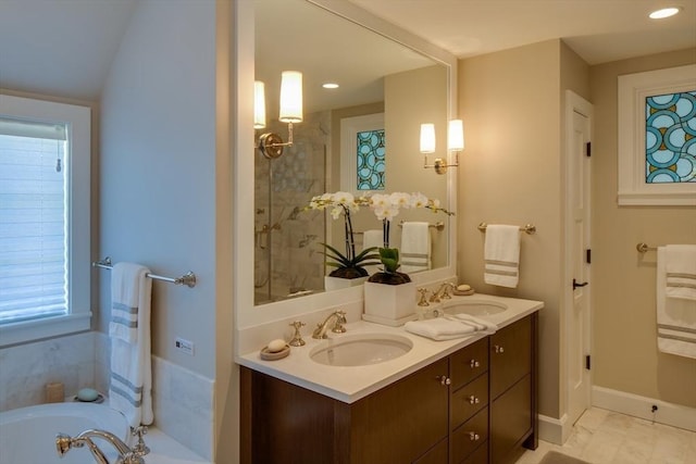 bathroom featuring vanity, tile patterned floors, and a bathing tub