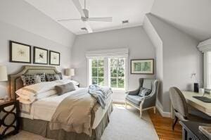 bedroom featuring ceiling fan and lofted ceiling