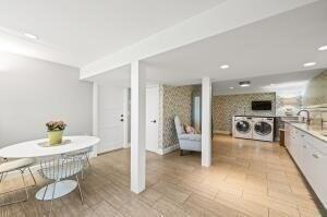 interior space featuring independent washer and dryer and sink