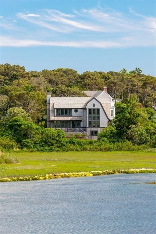 view of front of property featuring a water view