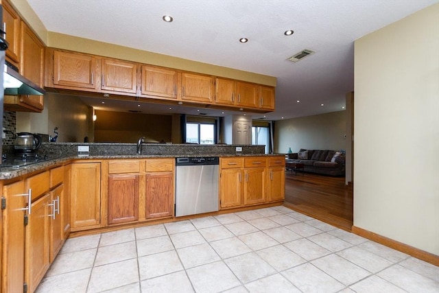 154 Lynnway Unit 511, Lynn, MA 01902 - kitchen featuring stainless steel dishwasher, brown cabinets, dark stone countertops, a peninsula, and open floor plan