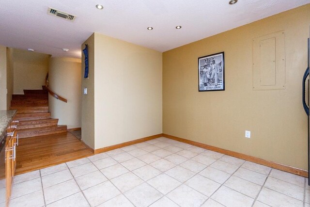 154 Lynnway Unit 511, Lynn, MA 01902 - unfurnished room featuring recessed lighting, electric panel, light tile patterned flooring, and stairs