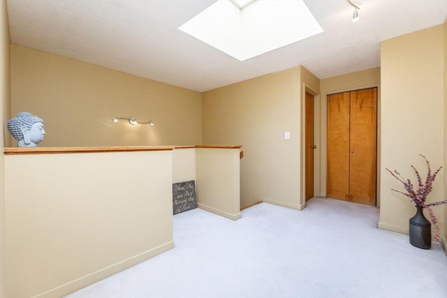 154 Lynnway Unit 511, Lynn, MA 01902 - empty room featuring a skylight and light colored carpet