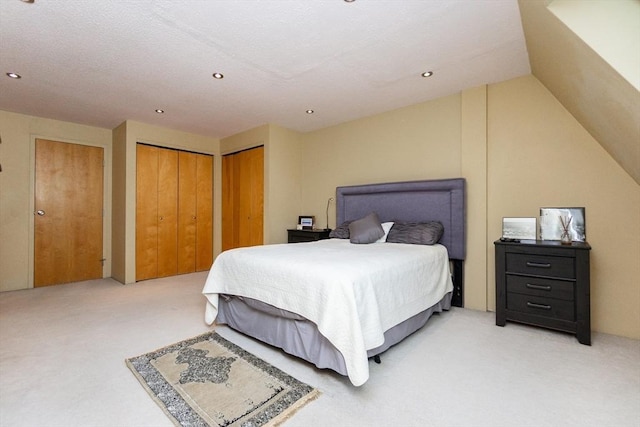 154 Lynnway Unit 511, Lynn, MA 01902 - bedroom with light colored carpet, two closets, recessed lighting, and lofted ceiling