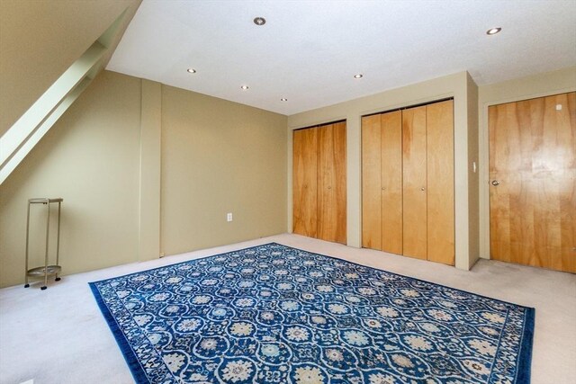 154 Lynnway Unit 511, Lynn, MA 01902 - unfurnished bedroom with carpet floors, two closets, and recessed lighting
