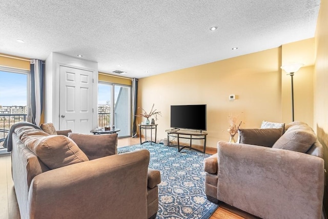 154 Lynnway Unit 511, Lynn, MA 01902 - living area featuring a textured ceiling, light wood finished floors, and recessed lighting