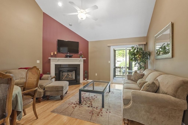 108 Green Briar Rd Unit 108, Fitchburg, MA 01420 - living room featuring light wood-type flooring, a ceiling fan, high vaulted ceiling, and a fireplace with flush hearth