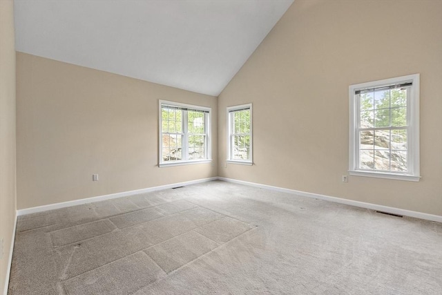 108 Green Briar Rd Unit 108, Fitchburg, MA 01420 - spare room featuring high vaulted ceiling, plenty of natural light, baseboards, and carpet flooring